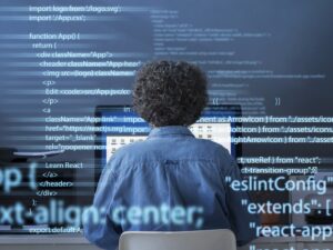 programming-background-with-person-working-with-codes-computer (1).jpg